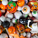 Assorted foil-wrapped Halloween candies: pumpkins, eyeballs, werewolves, ghosts, etc.